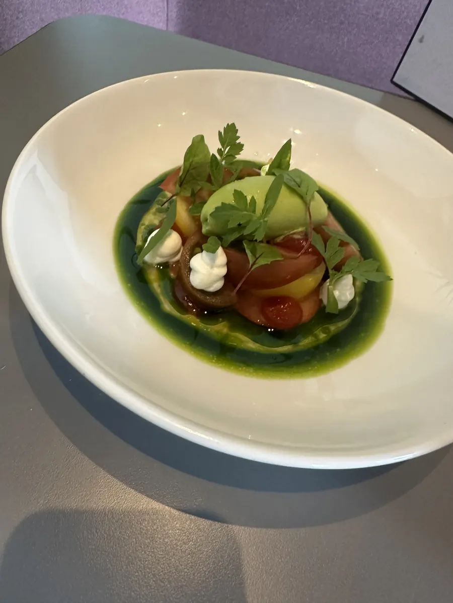 Herb-dressed dish in a deep green sauce